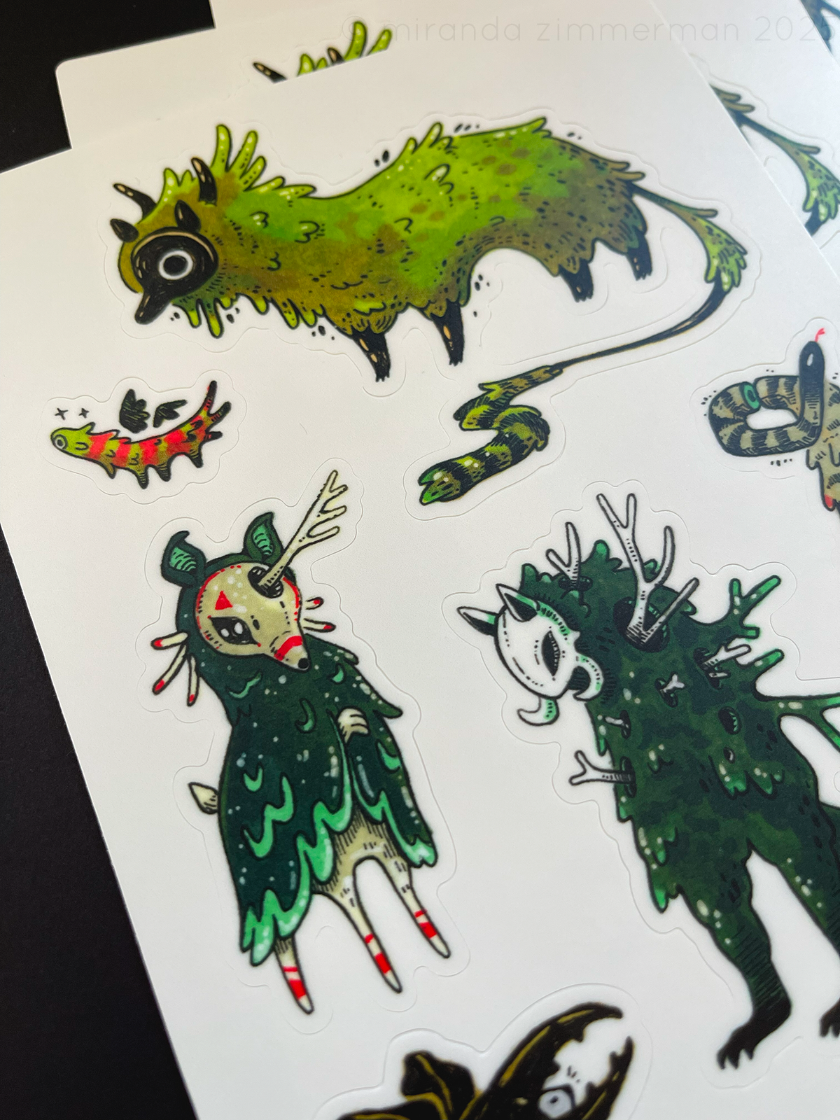 A close up of one of the sticker sheets to show the illustrative details.