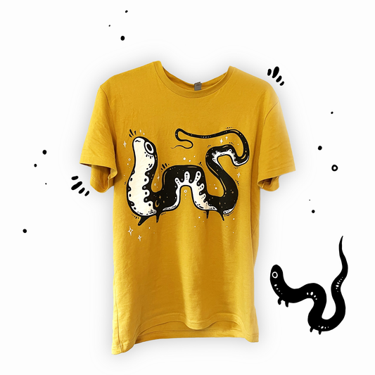 A gold-colored unisex crew neck t-shirt with a two-color screen print of a salamander design using black and white ink.