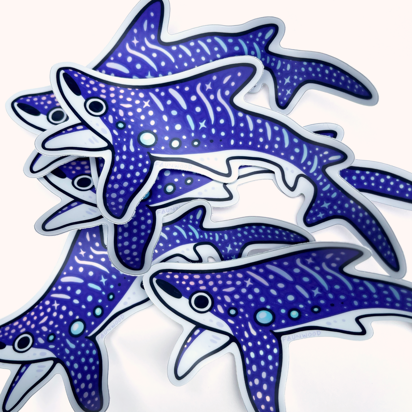 Several holo vinyl sticker of a purple illustrated whale shark. The spot and star markings on the whale shark are holographic. This listing is for a single sticker, even though several are pictured in this photo.