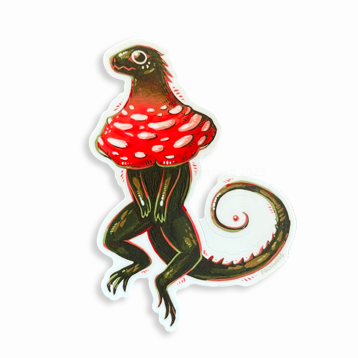 Matte vinyl sticker of a green "frilled lizard" with a red and white mushroom cap in place of frills.