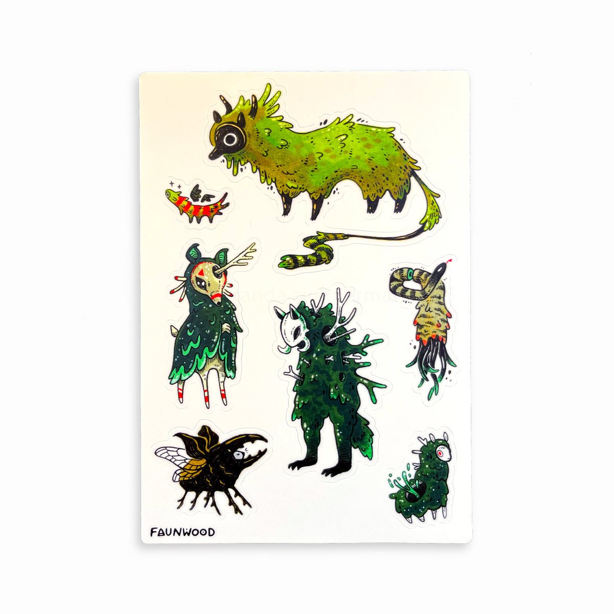 A sticker sheet with seven different mossy and green creature designs, illustrated with ink and markers.