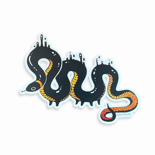 A semi-holo vinyl sticker of an illustrated ringneck snake creature with droplets of black goop.  The snake is black with a yellow-red gradient reflective belly.