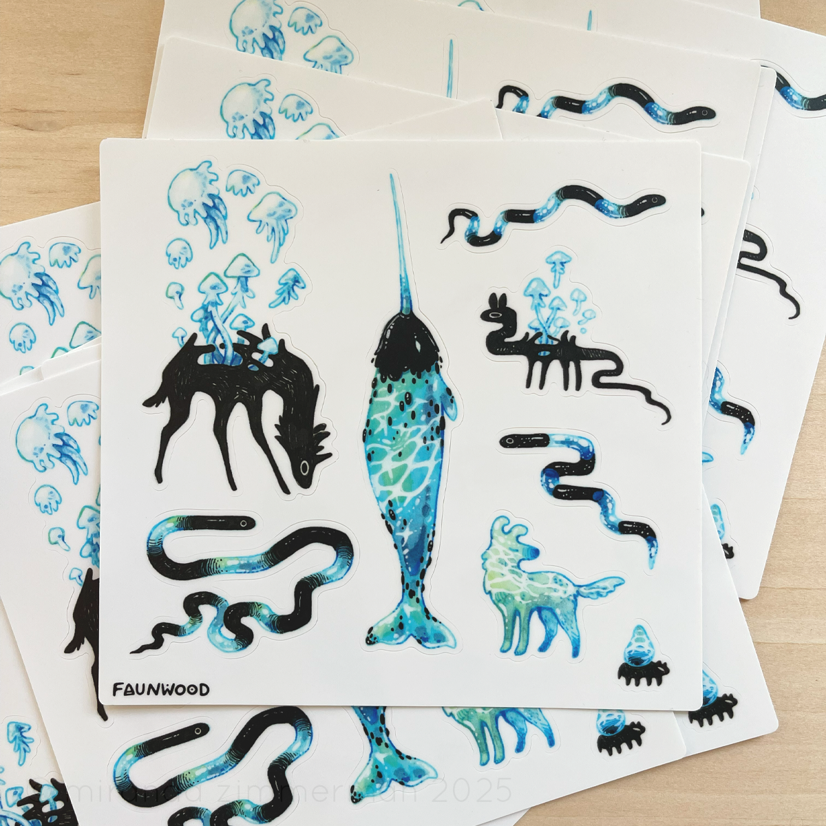 Several matte vinyl sticker sheets with traditionally illustrated water-themed creatures.  Designs include snakes, a water dog, and a narwhal.  This listing is for a single sheet, even though several are pictured here.